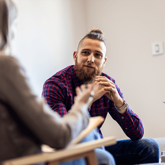 Man talking to a counsellor