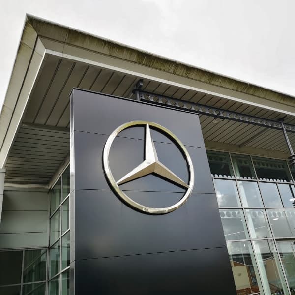 Mercedes showroom with logo. Mercedes-Benz, commonly referred to as Mercedes is known for producing luxury vehicles and commercial vehicles. The headquarters is in Stuttgart, Baden-Württemberg.