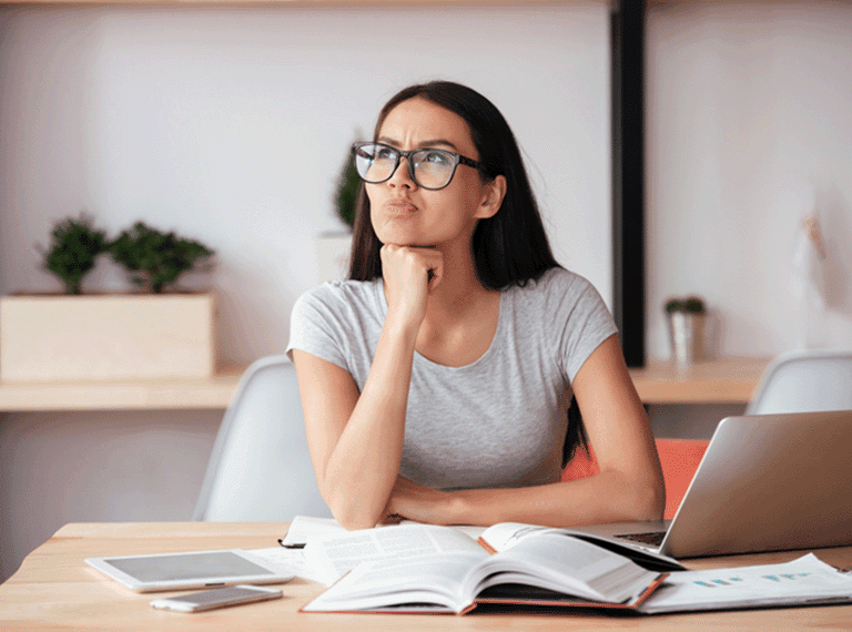 Woman at work pondering