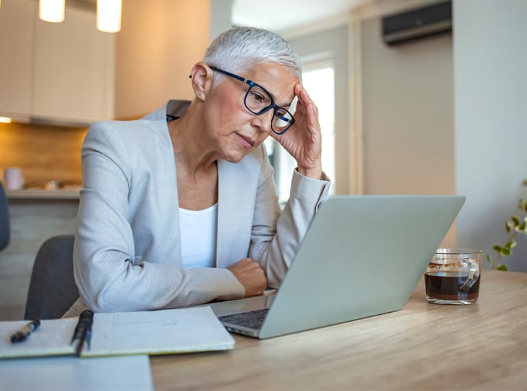 Mature woman stressed at work