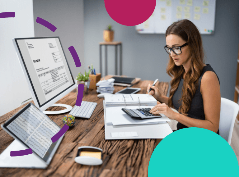 Accountant at desk doing sums