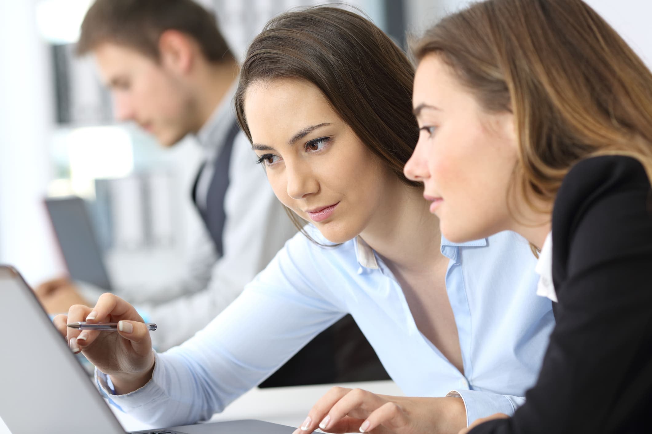 Businesswomen working on line together